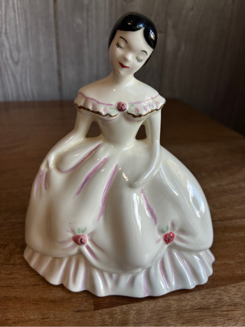 vintage porcelain crinoline lady figurine featuring a glossy white gown
